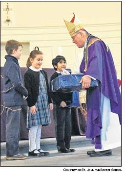 Students present Bishop Malone with a gift!